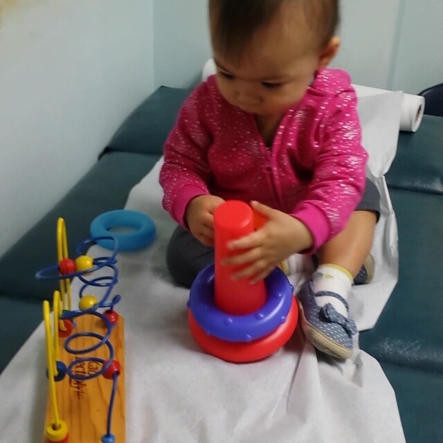 Baby playing with Toys in a doctors office