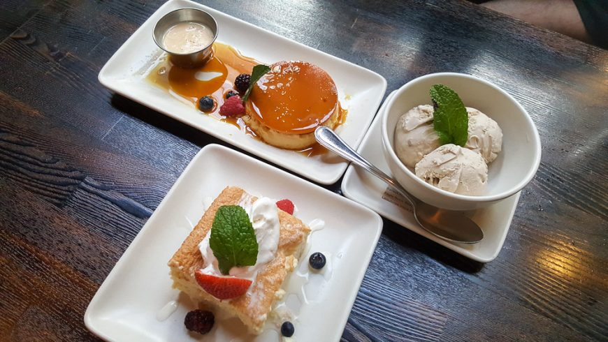 A trio of desserts. Flan, churro ice-cream and tres leches cake.